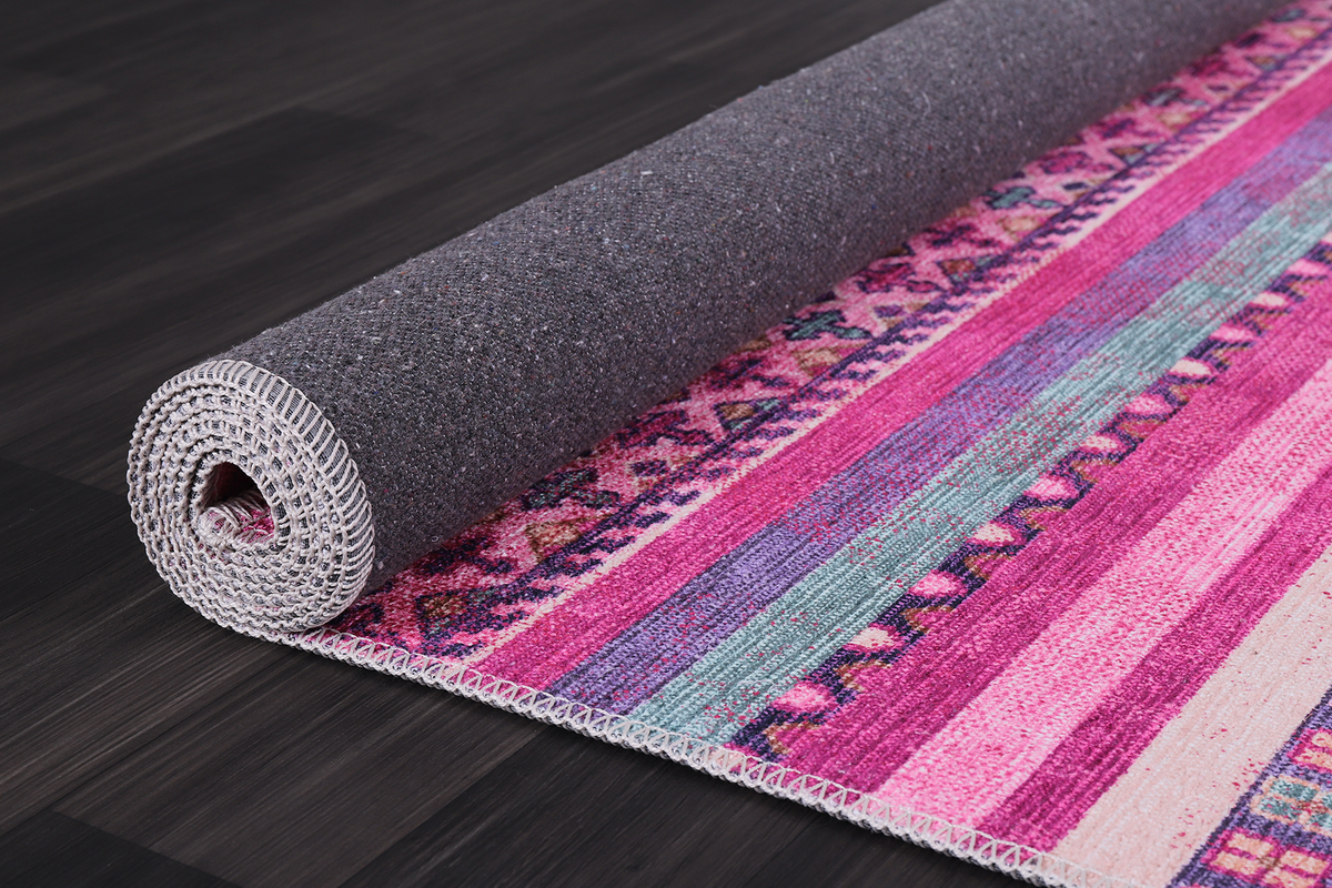 Bohemian pink striped washable rug by Netline Home with vibrant pink and white stripes, soft and durable for home decor.