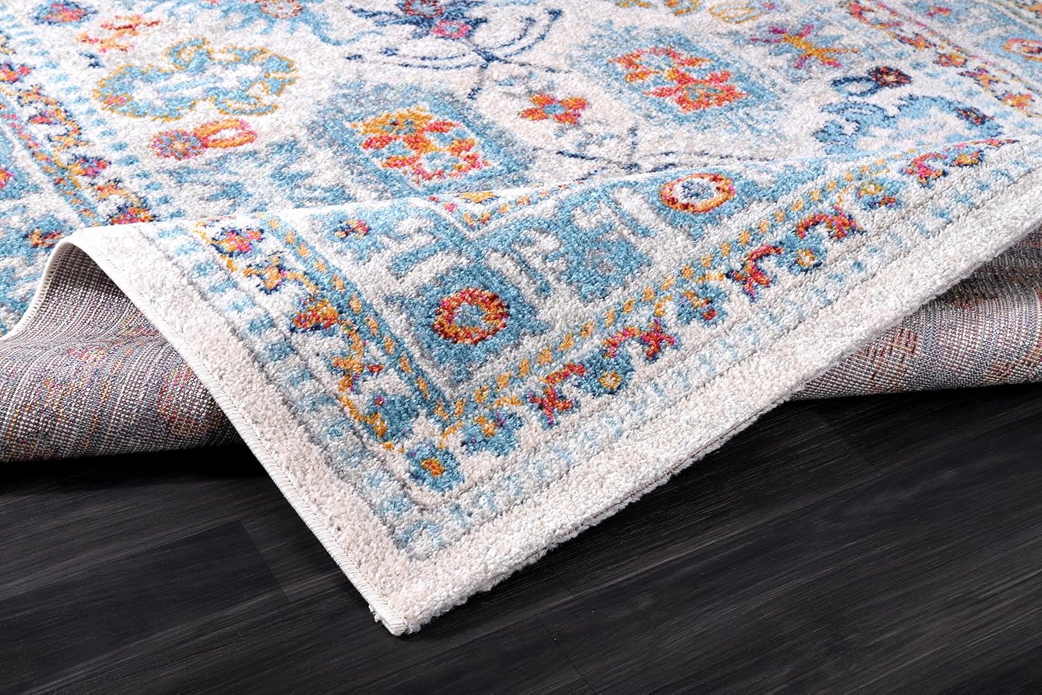 Cream and blue oriental-style rug with vintage design, soft medium pile, stain-resistant fabric, suitable for living room and bedroom.