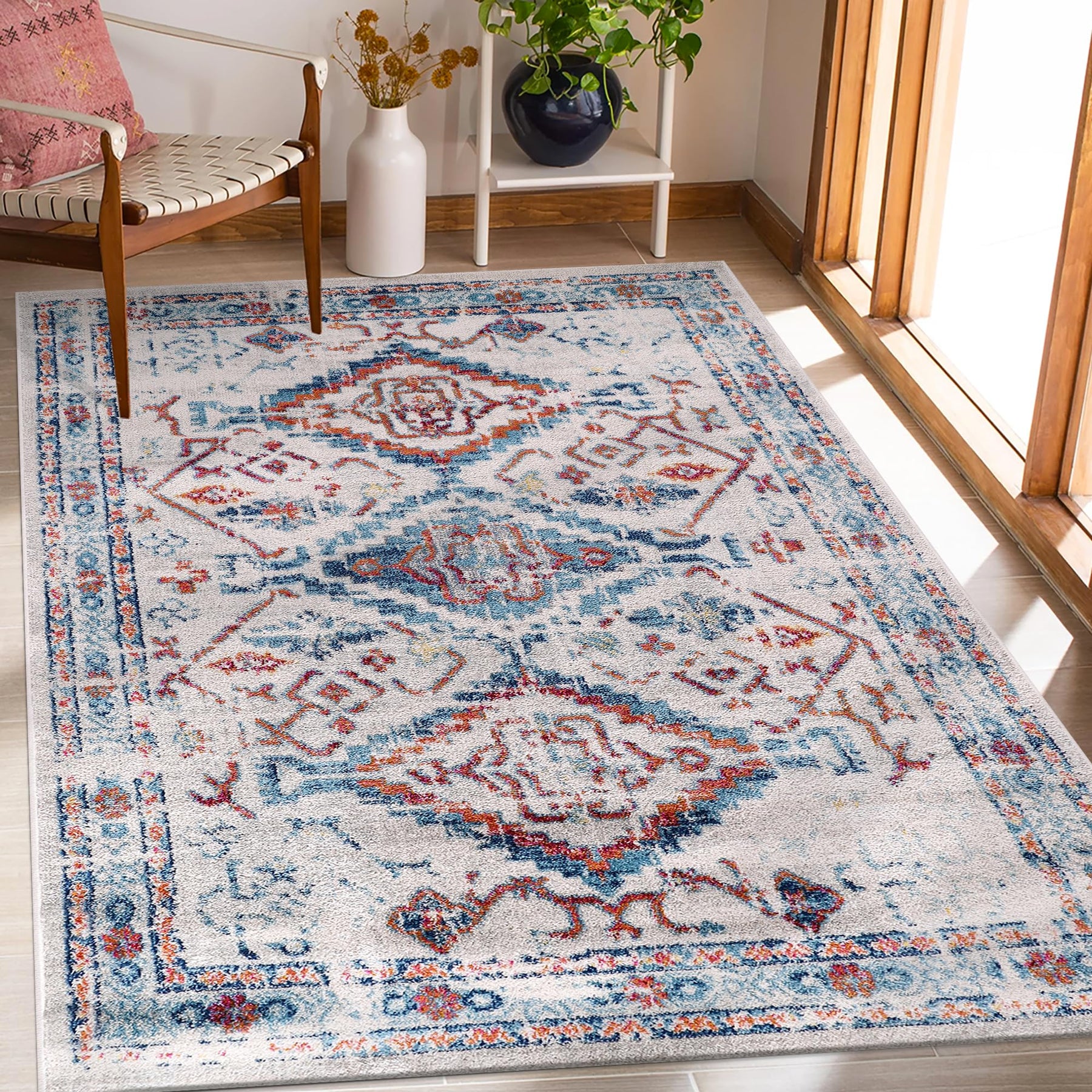 Cream and blue oriental design rug with traditional vintage pattern, soft medium pile, stain-resistant, suitable for living room or bedroom.