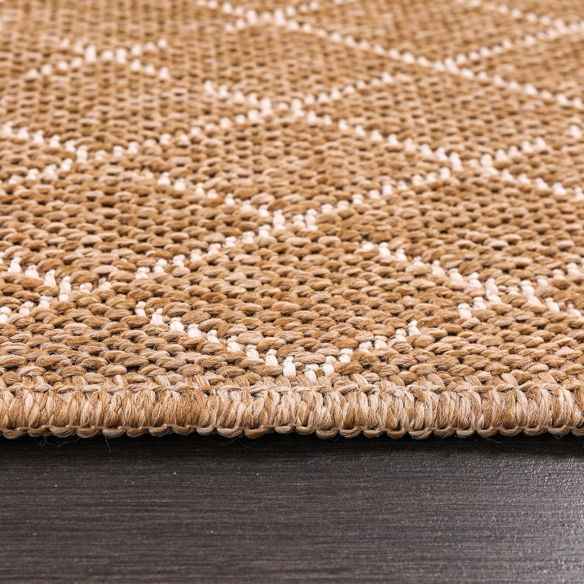 Jute-effect washable runner rug from Netline Home, suitable for indoor and outdoor use, with a textured natural fiber appearance.