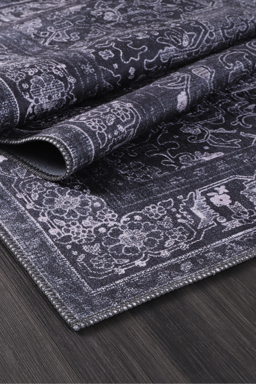 Black geometric medallion washable rug by Netline Home featuring tribal-inspired designs and intricate patterns.