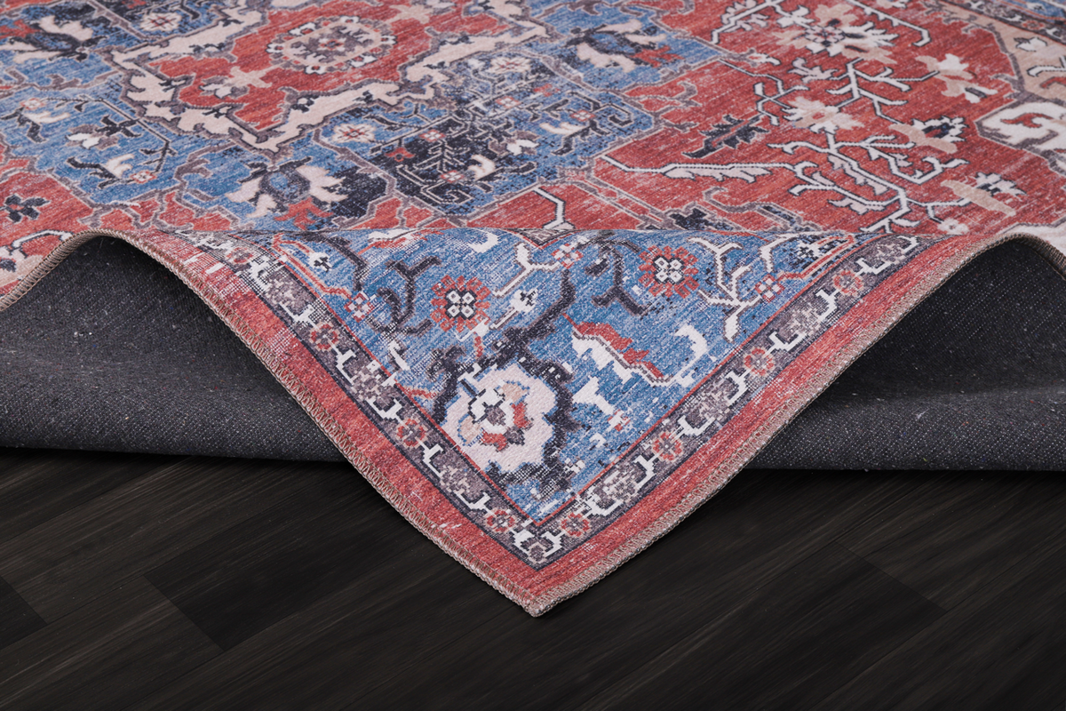 Multicolor tribal medallion washable rug by Netline Home featuring vibrant geometric patterns on a soft fabric surface.
