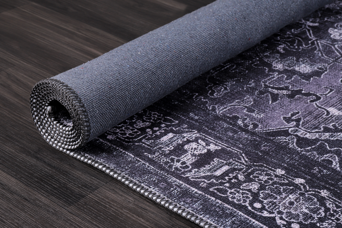 Black geometric medallion washable rug by Netline Home with tribal design, featuring bold patterns and a soft, durable surface.