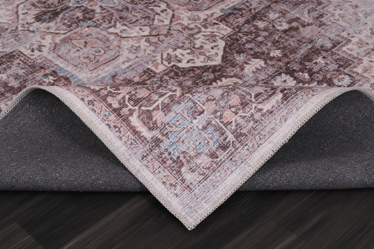 Multicolor geometric washable rug by Netline Home featuring tribal-inspired patterns in vibrant colors on a soft fabric surface.