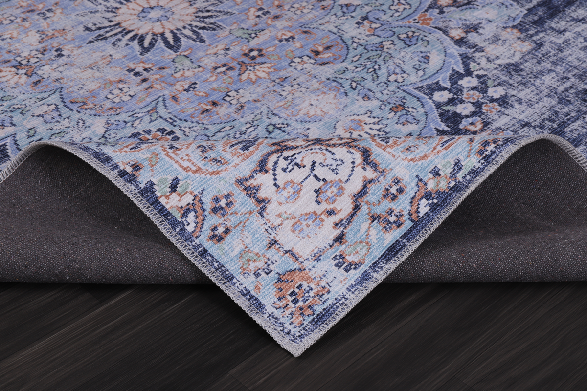 Traditional blue abstract medallion washable rug by Netline Home, featuring intricate design and vibrant colors.