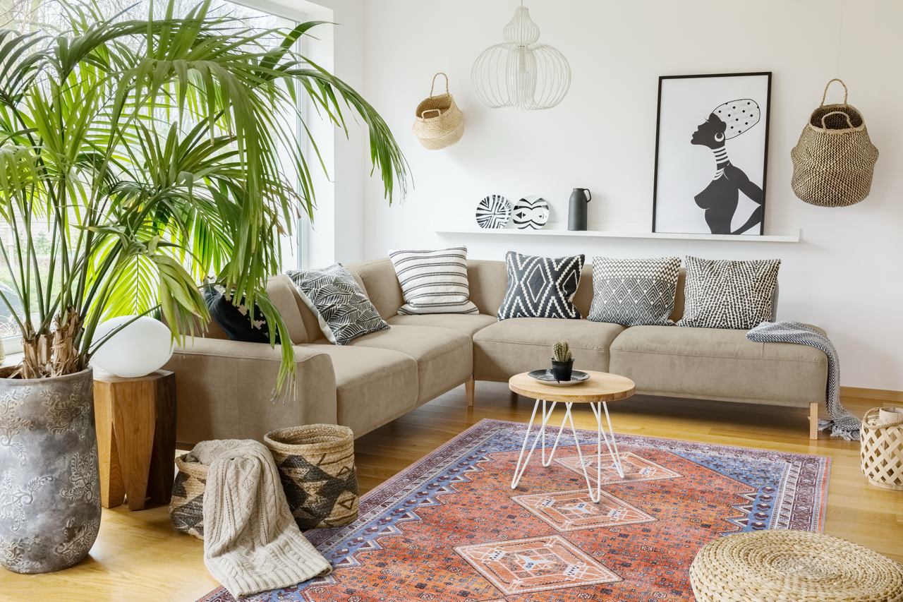 Colorful geometric washable rug by Netline Home featuring tribal multicolor pattern on a neutral background.