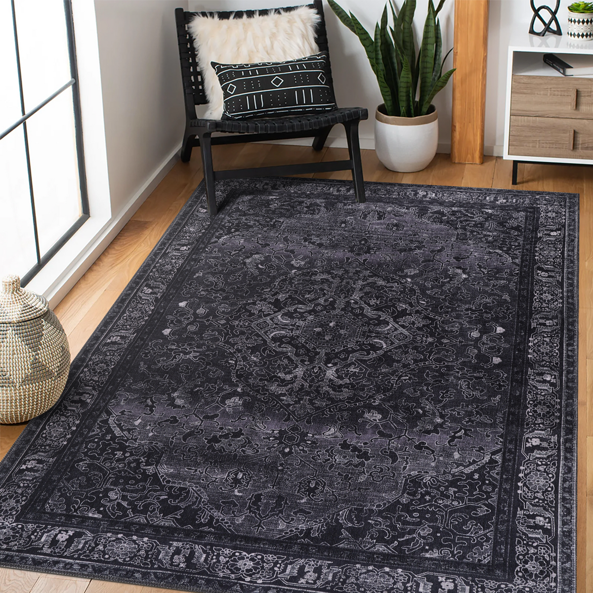 Black geometric medallion washable rug by Netline Home featuring tribal patterns and intricate design in a rectangular shape.