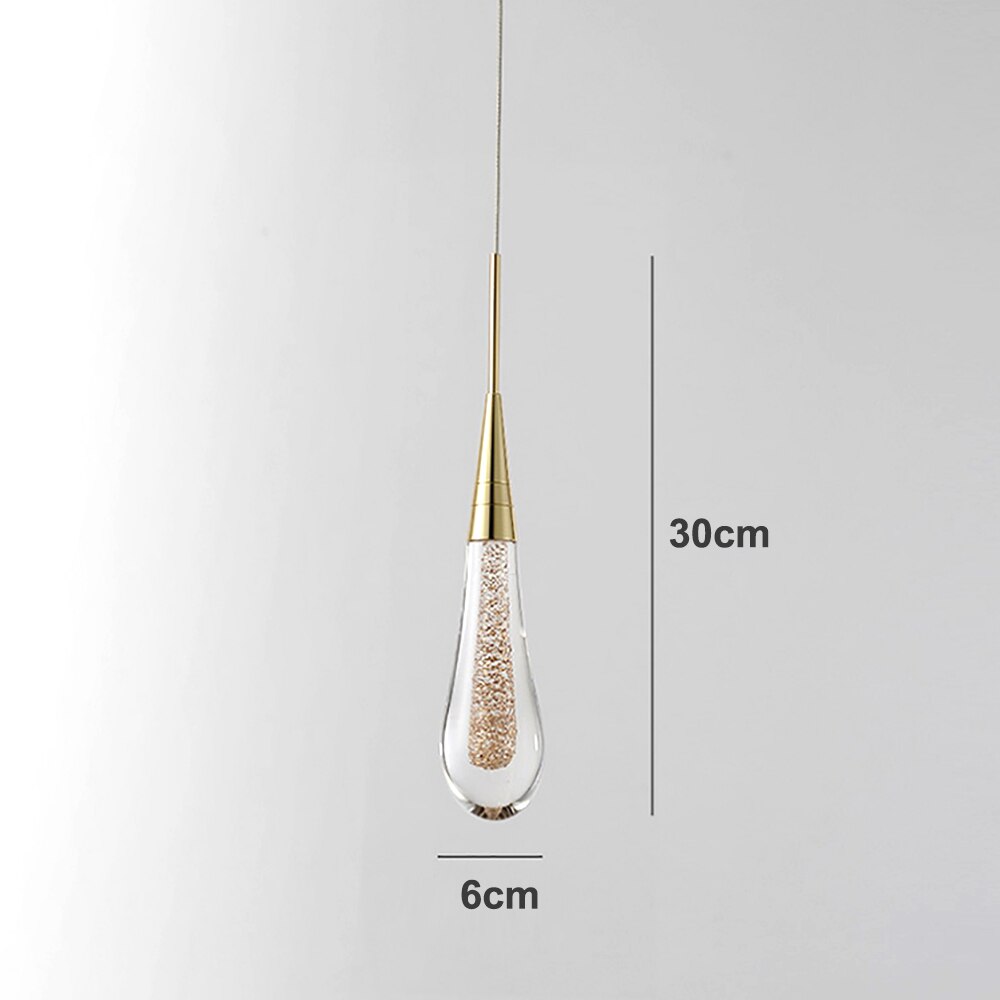 Glass drop pendant light with warm LED bulbs hanging from a string, ideal for UK home lighting by Light My House