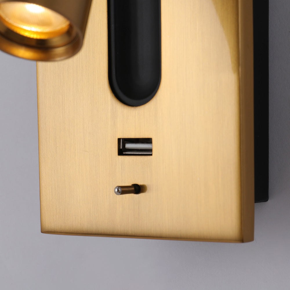 LED bedside reading wall light with USB charger and switch by Light My House, mounted on a wall next to a bed.