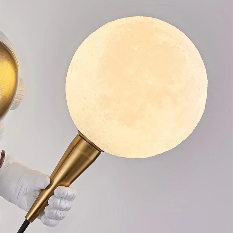 Light My House astronaut LED wall light featuring a moon globe design, ideal for kids' bedrooms in the UK.