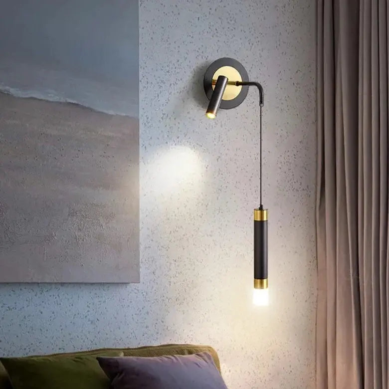 Bold gold wall lamp with integrated reading light and warm white LED lighting, stylishly designed for modern interiors.