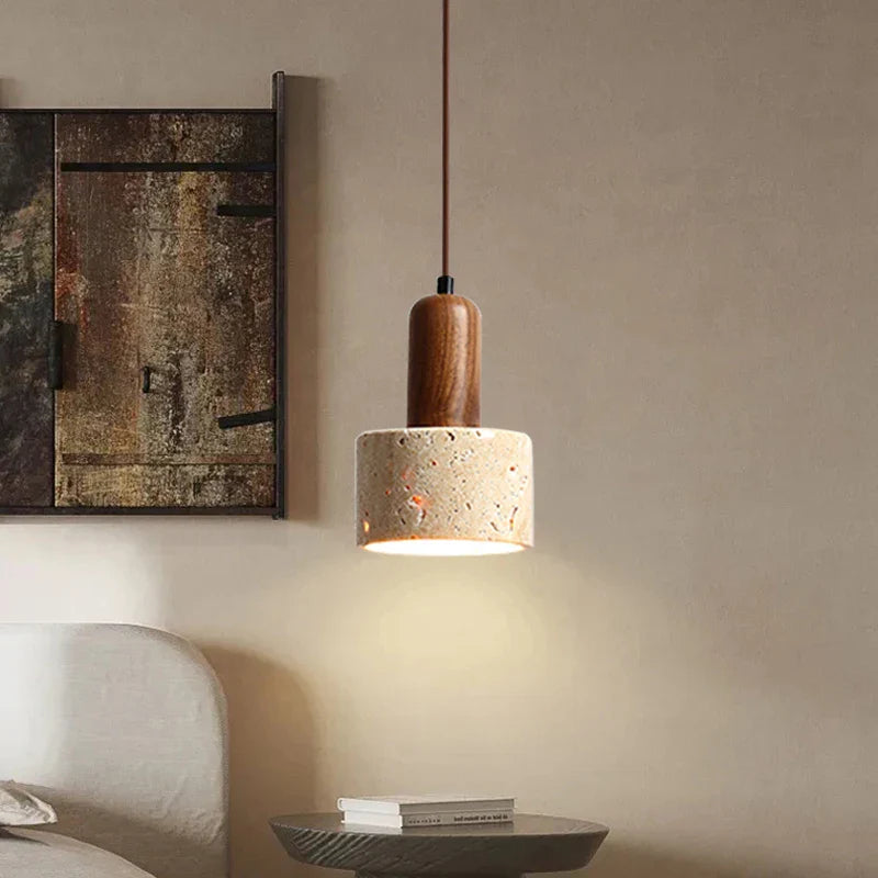 Beige and brown travertine pendant light from Light My House hanging above a kitchen island ceiling fixture.