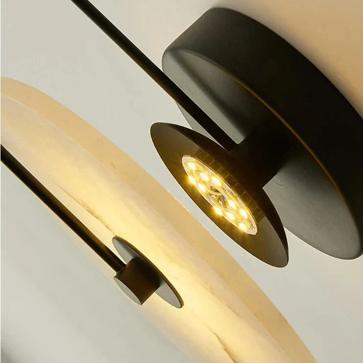 Modern marble wall lamp with disc texture and warm LED light, ideal for contemporary home decor by Light My House