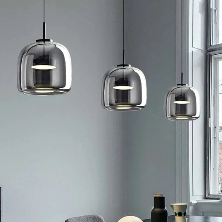 Black gold pendant lamp by Light My House with adjustable height and warm LED light, modern design for stylish interior lighting.