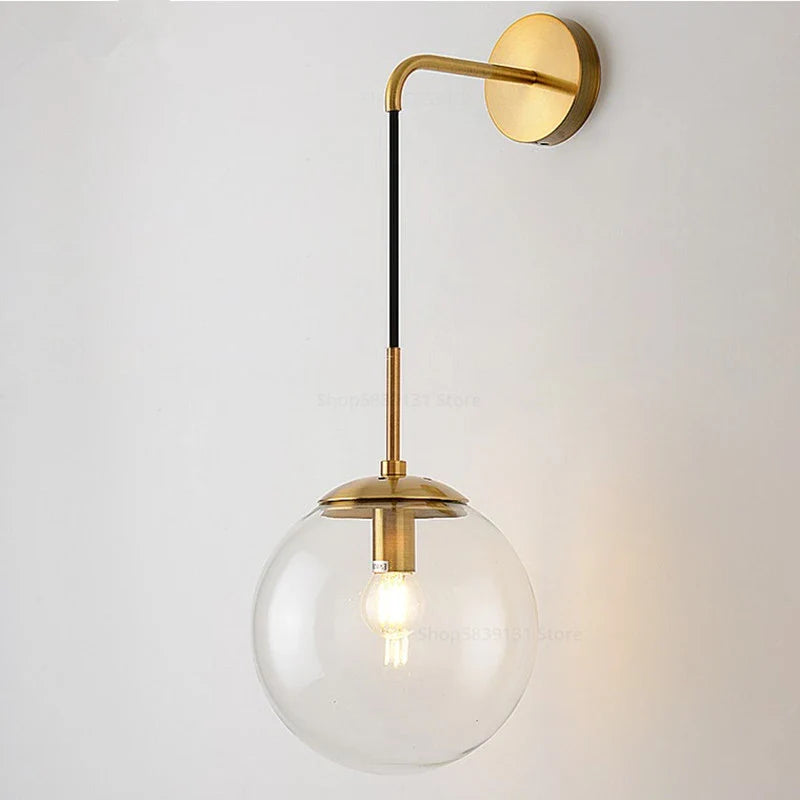 Mid-century glass globe hanging wall light by Light My House in amber, smoke, and clear glass with a sleek modern design.
