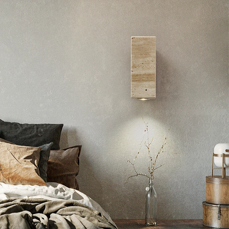 Beige and brown travertine wall light by Light My House, waterproof indoor outdoor lighting fixture on a wall.