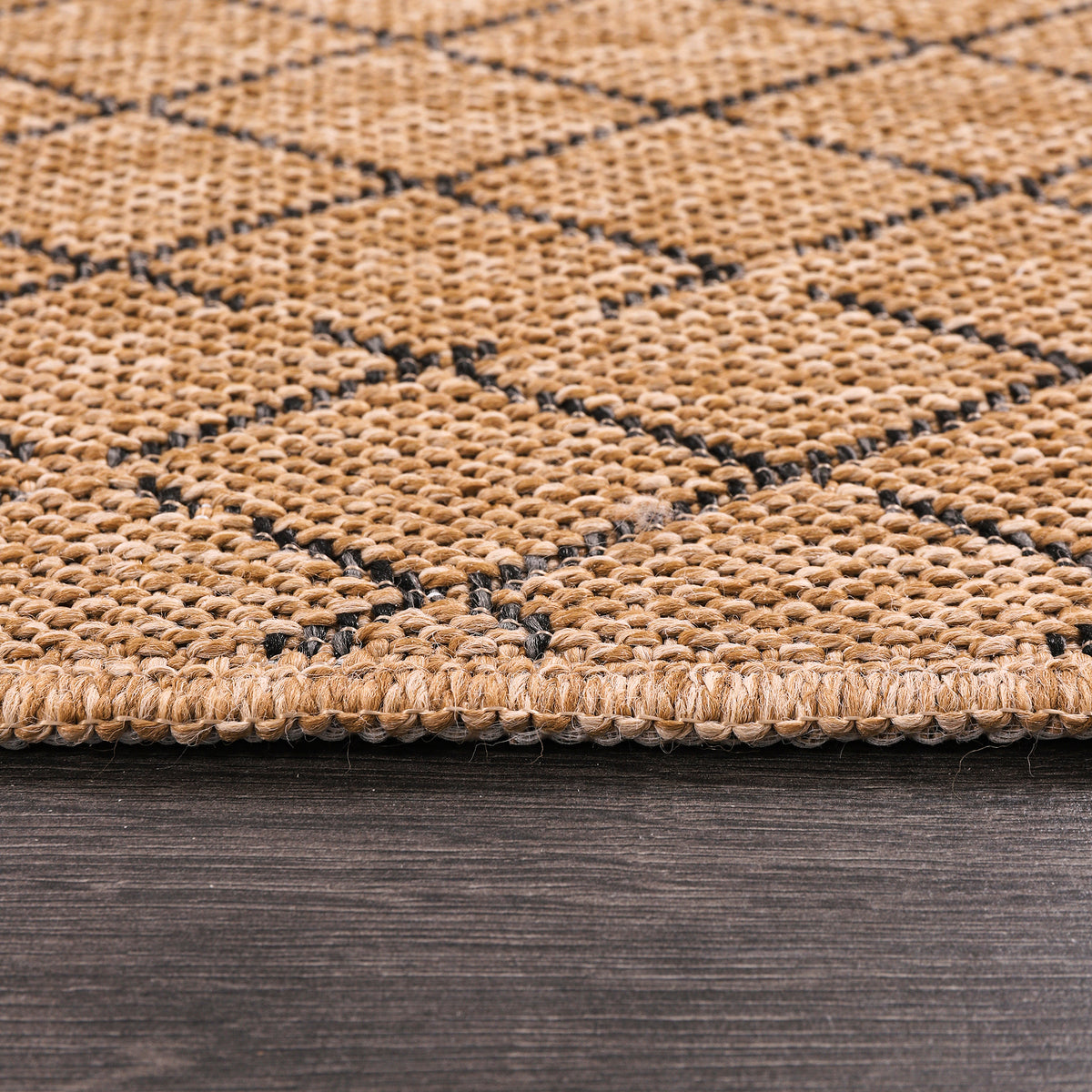 Diamond Weave Jute-Effect Rug by Netline Home, washable outdoor/indoor rug with black geometric pattern and non-slip, weatherproof design.