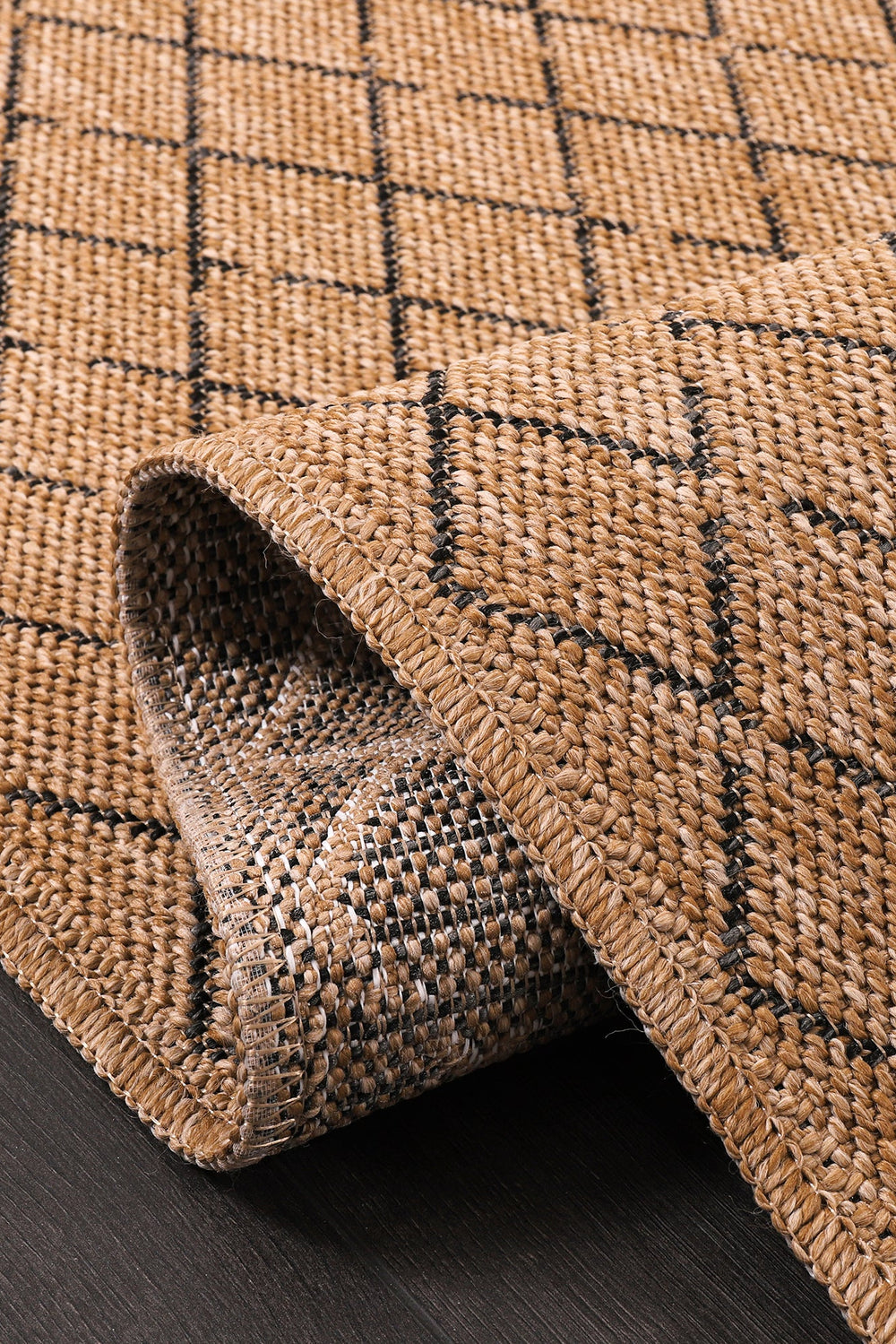 Diamond Weave Jute-Effect Rug by Netline Home, natural indoor-outdoor washable rug with black geo pattern and non-slip, weatherproof design.