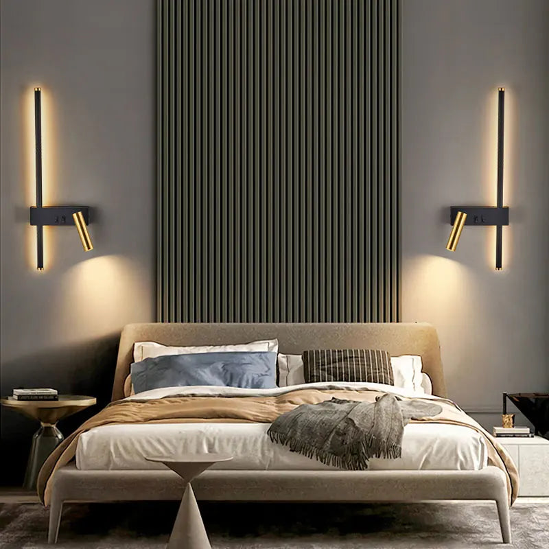 Black LED wall lamp by Light My House with bold gold accents, featuring dual switches for bedside reading and ambient lighting.
