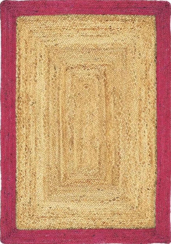 Bordered Raspberry Jute Rug shown in an illustrative room
