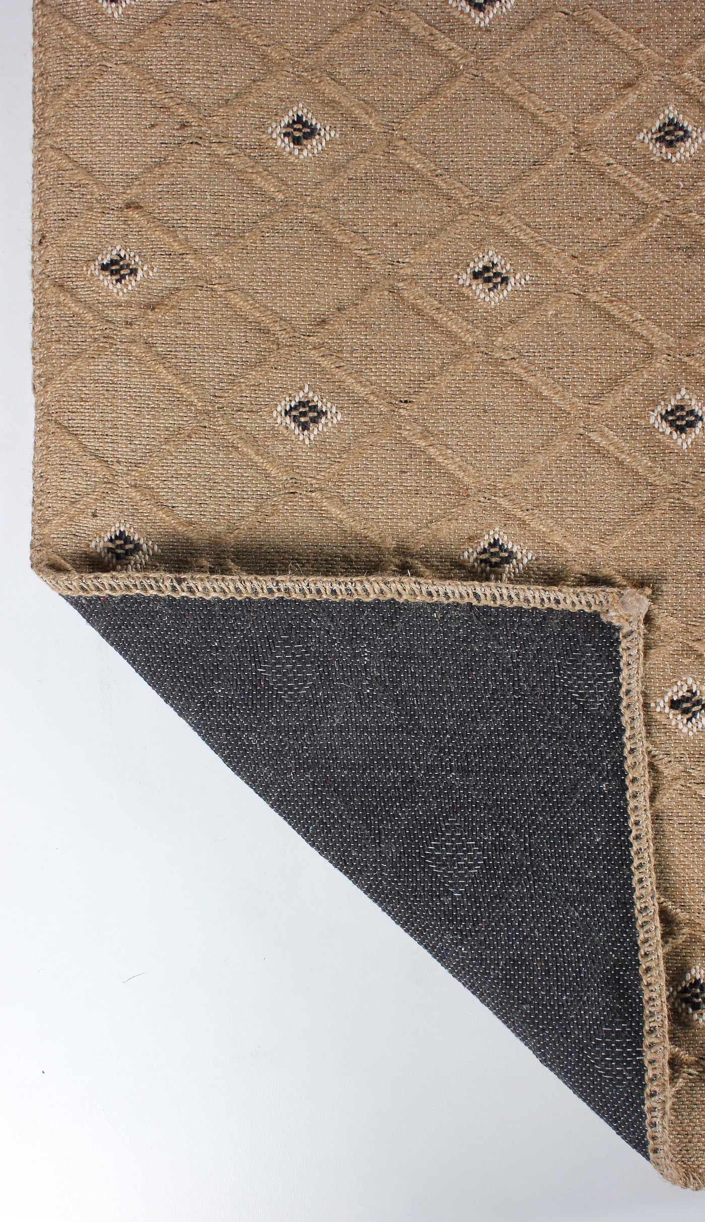 Natural jute geometric washable rug by Netline Home featuring beige and black pattern with cotton backing, eco-friendly flatweave design.