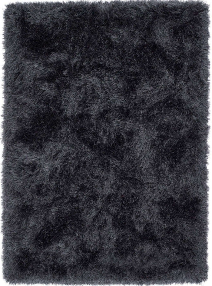 Extravagance Dark Grey Shaggy Rug shown in an illustrative room