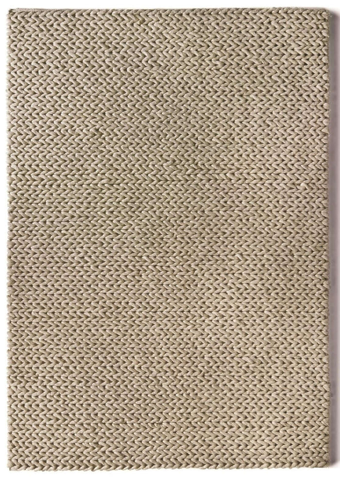 Fusion Oyster Braided Wool Rug shown in an illustrative room
