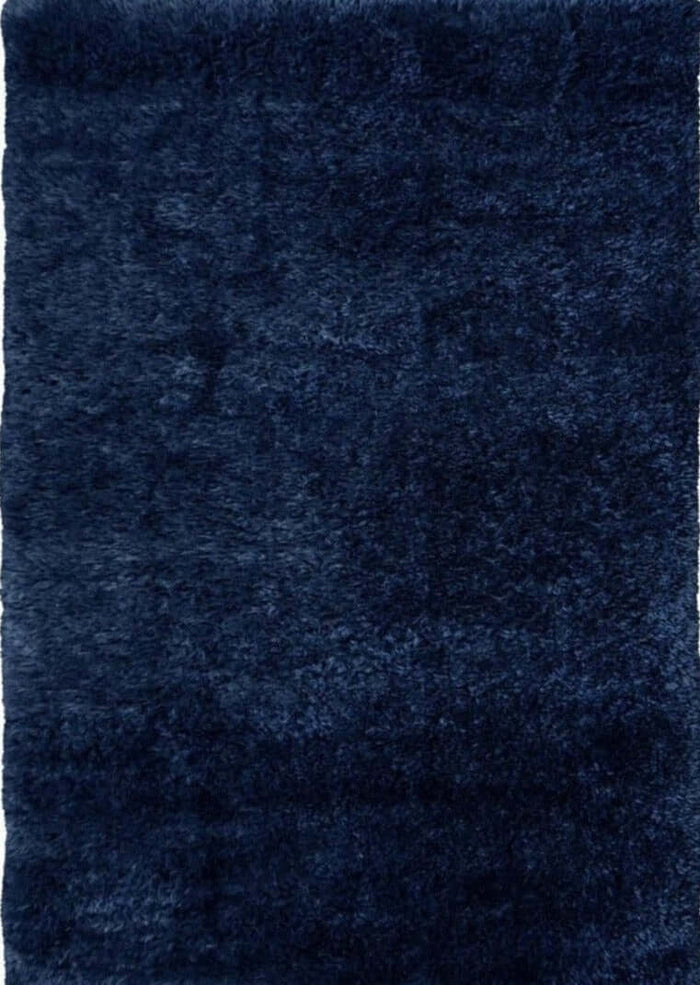 Lagom Navy Shaggy Rug shown in an illustrative room