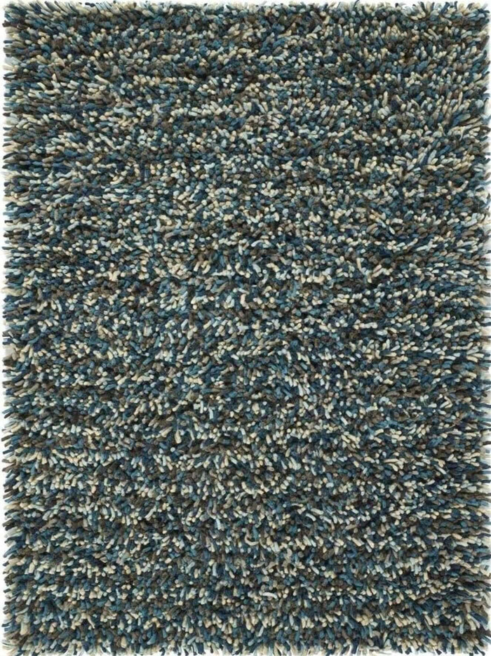 Rocks Blue Shaggy Pile Wool Rug shown in an illustrative room