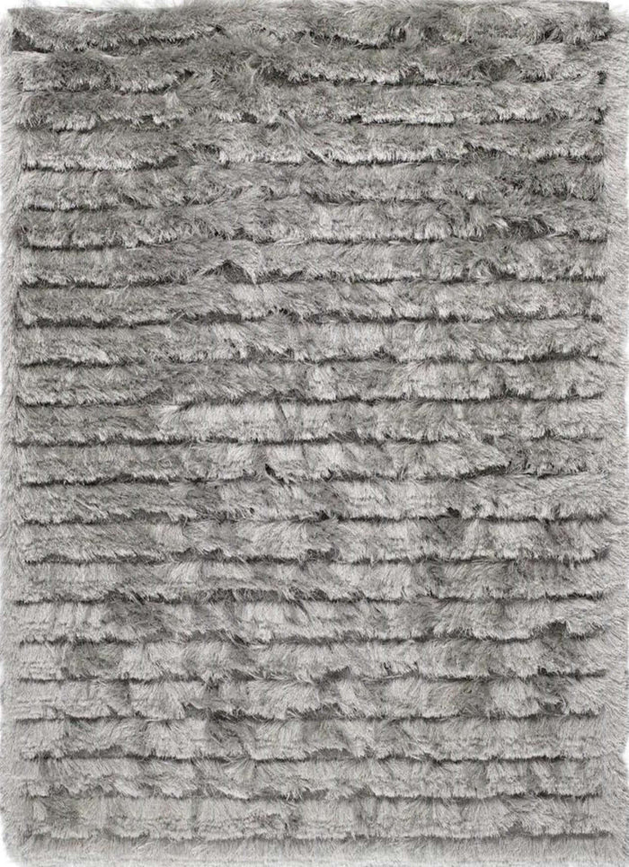 Carved Glamour Silver Grey Shaggy Rug shown in an illustrative room