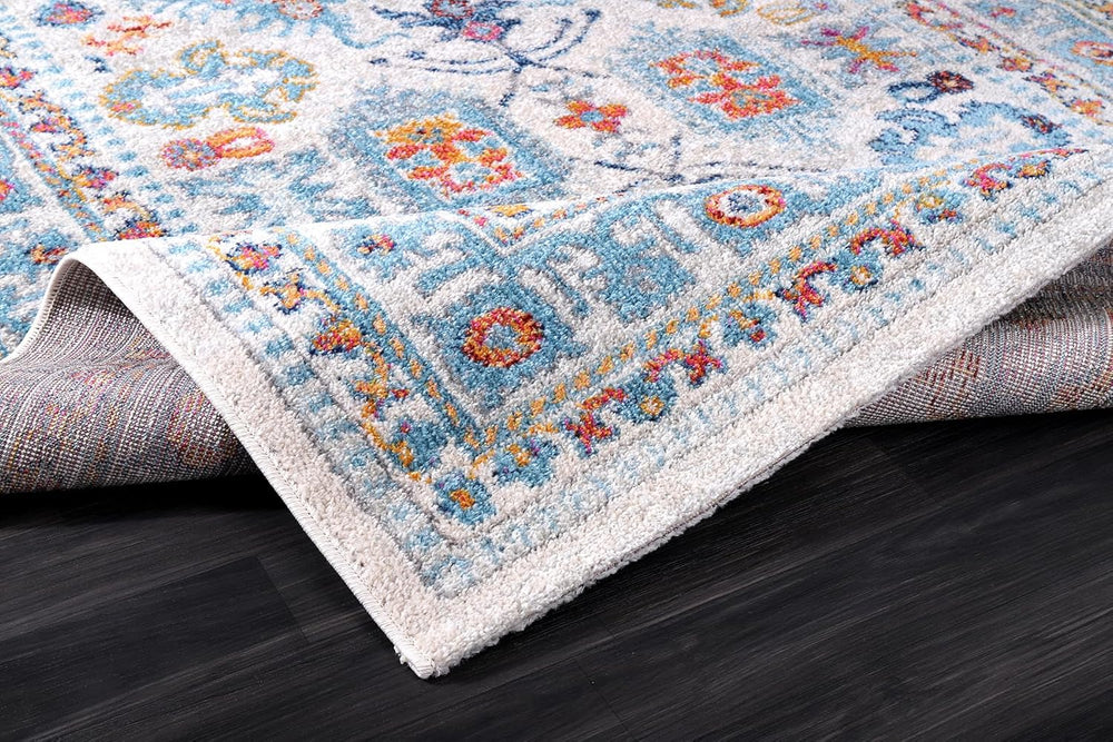 Cream and blue oriental-style rug with vintage design, soft medium pile, stain-resistant fabric, suitable for living room and bedroom.