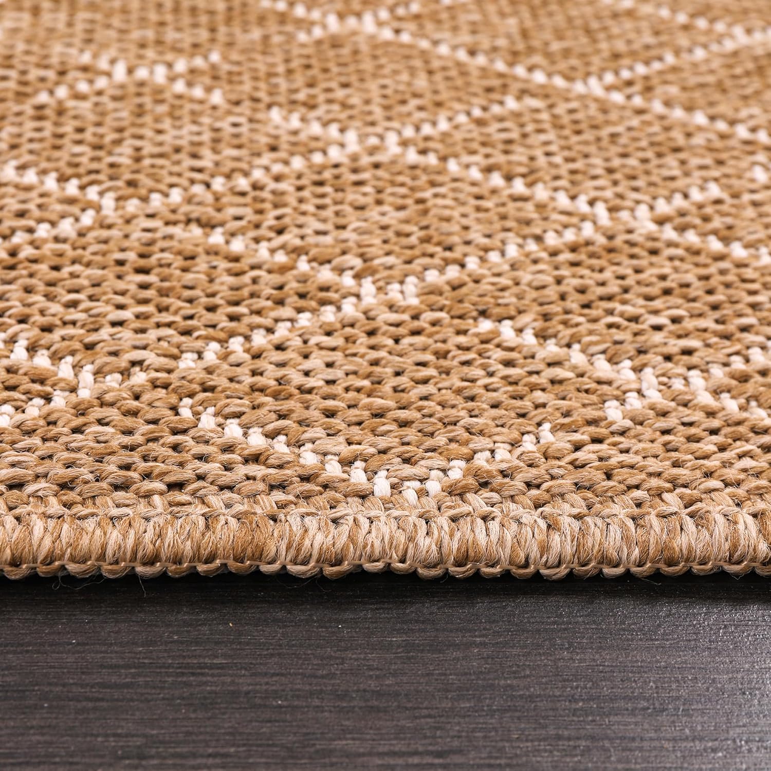 Jute-effect washable runner rug from Netline Home, suitable for indoor and outdoor use, with a textured natural fiber appearance.