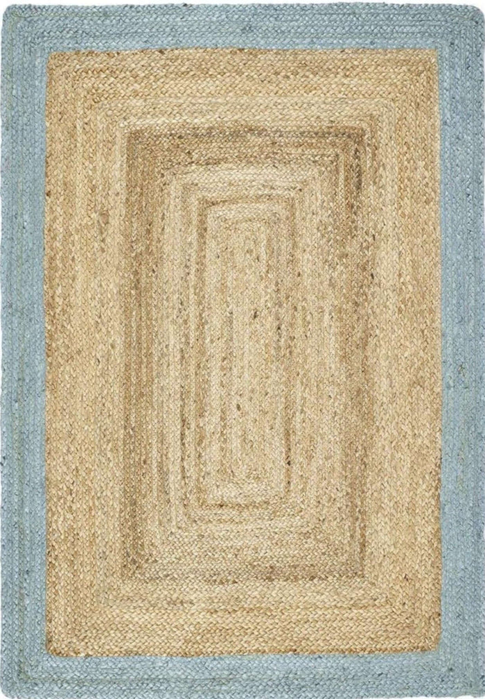 Bordered Duck Egg Blue Jute Rug shown in an illustrative room