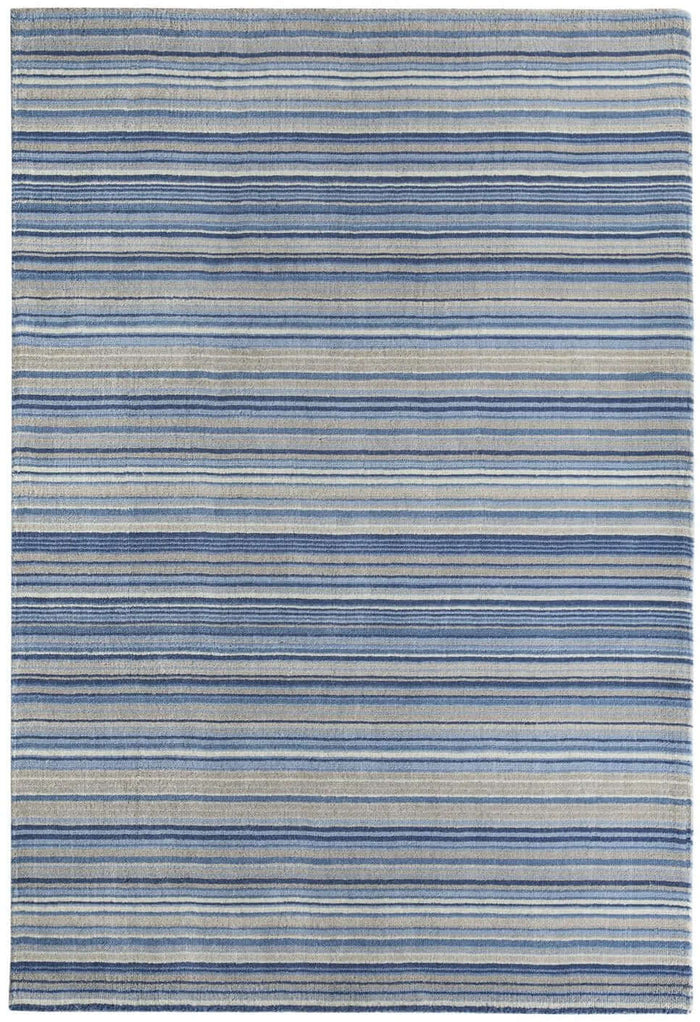 Fine Stripes Blue Wool Rug shown in an illustrative room