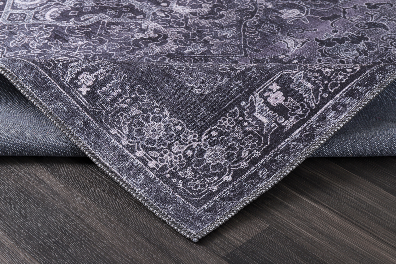 Black geometric tribal washable rug with medallion design from Netline Home, featuring bold patterns and vibrant colors.