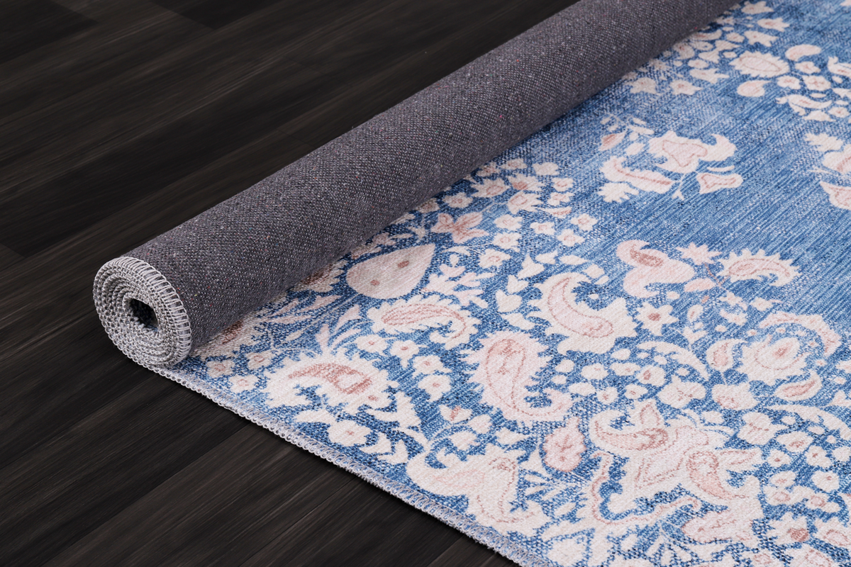 Modern beige floral washable rug by Netline Home showing a soft floral pattern on a neutral background.