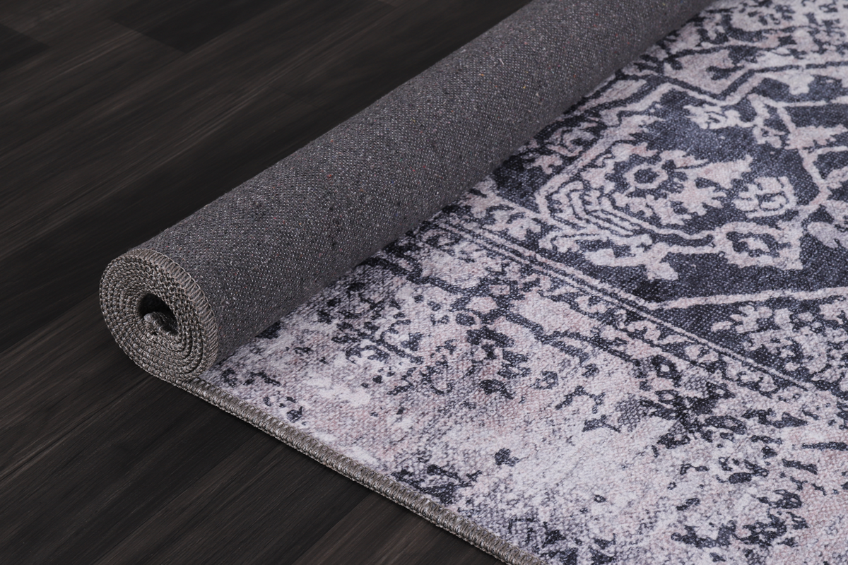 Traditional blue abstract washable rug by Netline Home featuring a modern, artistic design with vibrant blue and neutral tones.