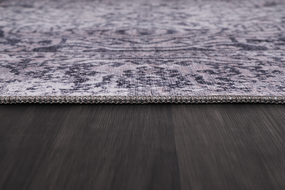 Blue abstract washable rug by Netline Home featuring a traditional design with intricate patterns and vibrant colors.