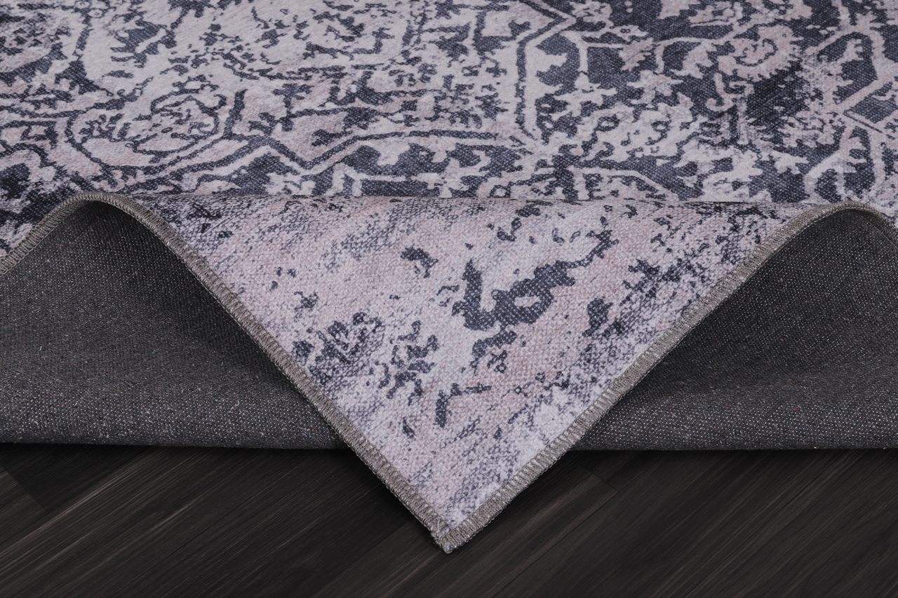 Traditional blue abstract washable rug by Netline Home with intricate pattern in soft shades, suitable for various home interiors.