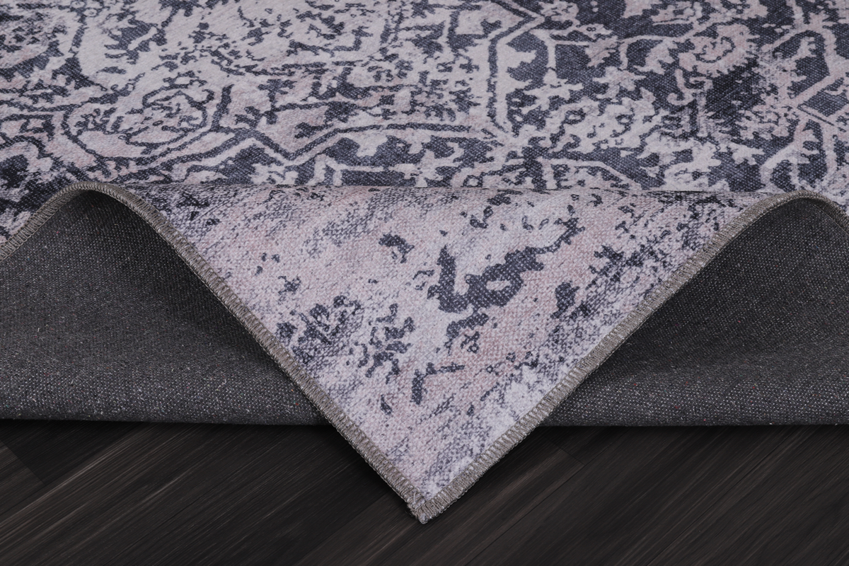 Traditional blue abstract washable rug by Netline Home with intricate pattern in soft shades, suitable for various home interiors.