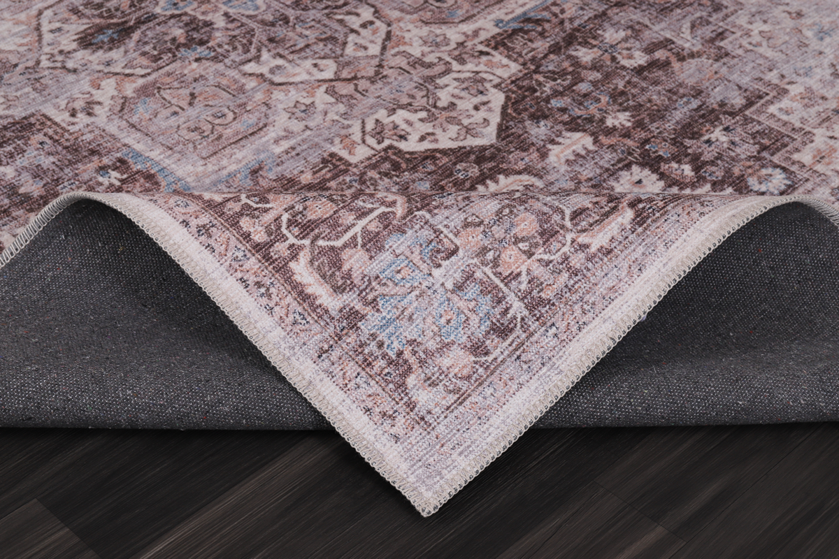 Multicolor geometric washable rug by Netline Home featuring tribal-inspired patterns in vibrant colors on a soft fabric surface.