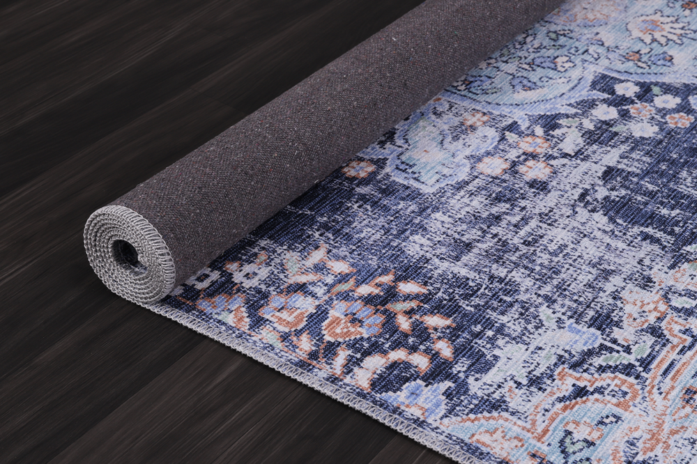 Traditional blue abstract medallion washable rug from Netline Home with intricate design and vibrant colors.