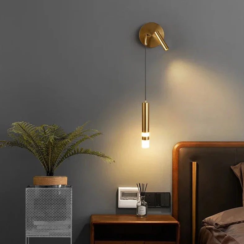 Bold gold wall lamp with integrated reading light and warm white LED illumination, stylish lighting fixture by Light My House