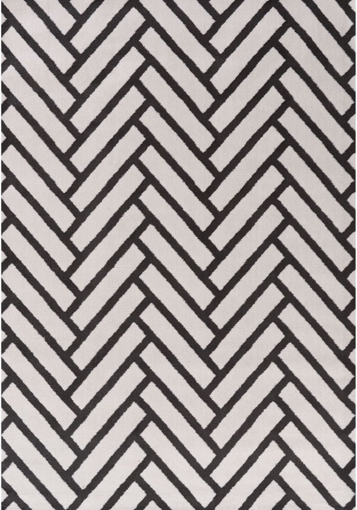 Loft Chevron Dark Grey Rug shown in an illustrative room