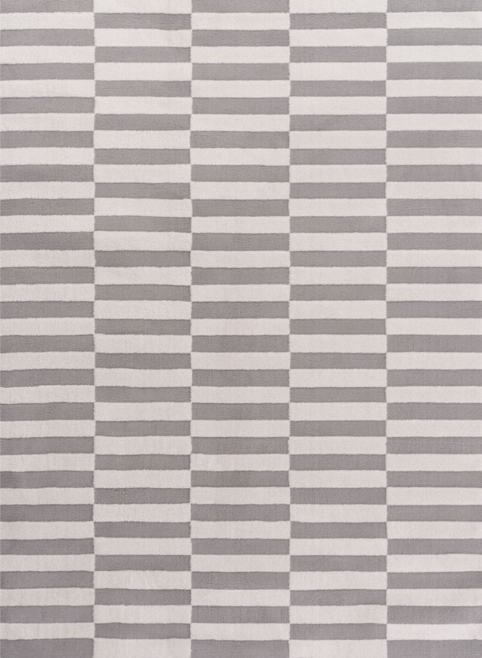 Loft Striped Grey Rug shown in an illustrative room