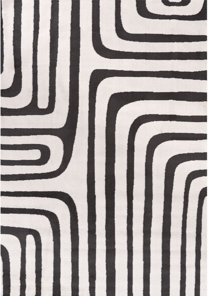 Loft Geometric Dark Grey Rug shown in an illustrative room