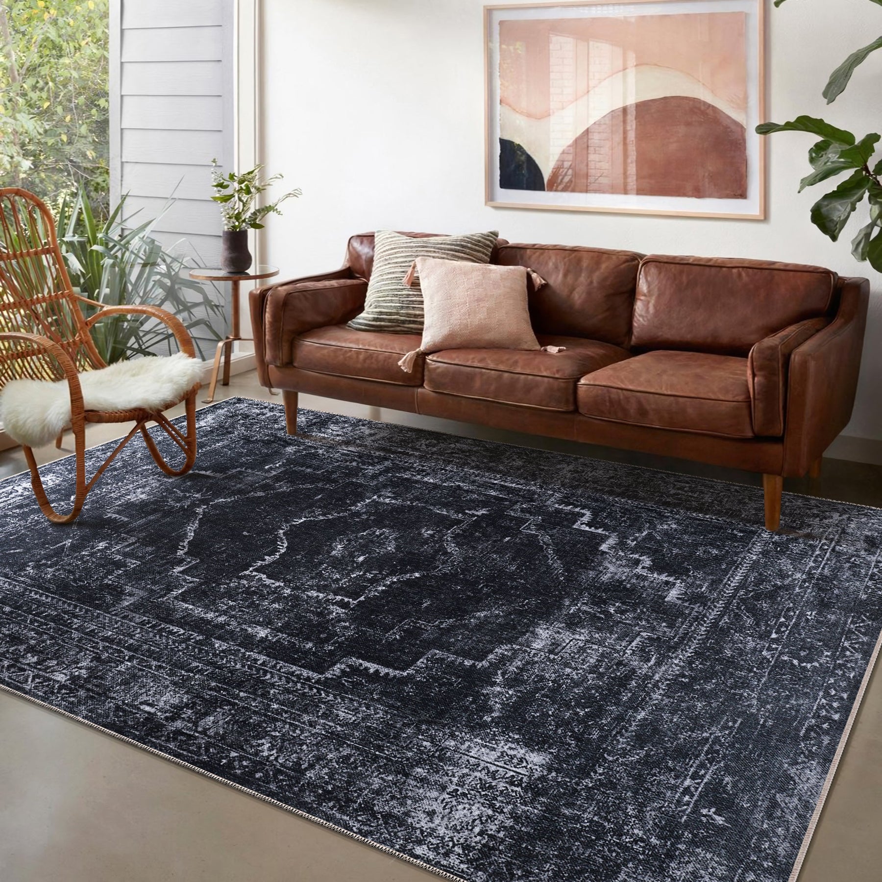 Machine washable black distressed rug with vintage medallion design by Netline Home, ideal for living room, bedroom, or office decor.