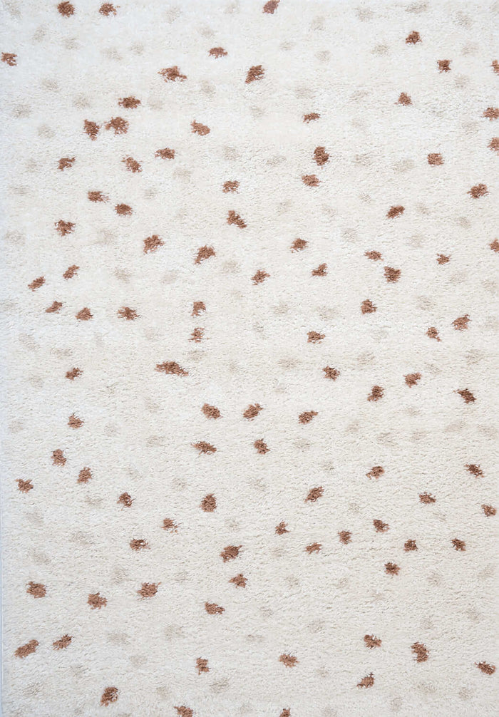 Moodi Shaggy Cream/Terra Biscotti Rug shown in an illustrative room