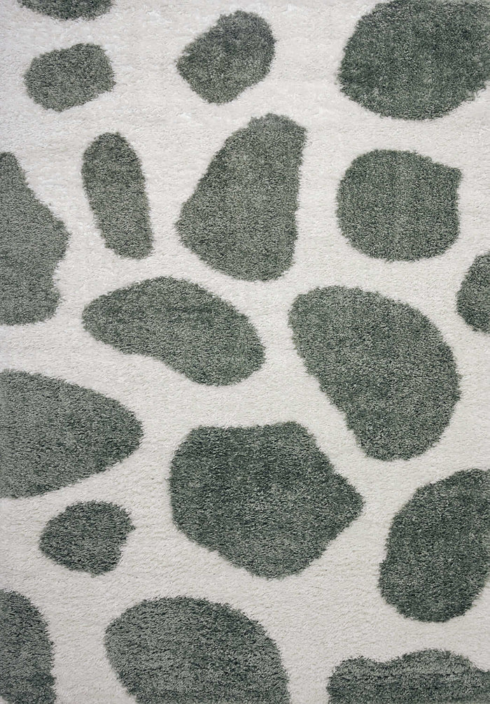 Moodi Shaggy Green Erosan Rug shown in an illustrative room