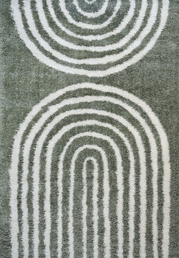 Moodi Shaggy Green Reverie Rug shown in an illustrative room